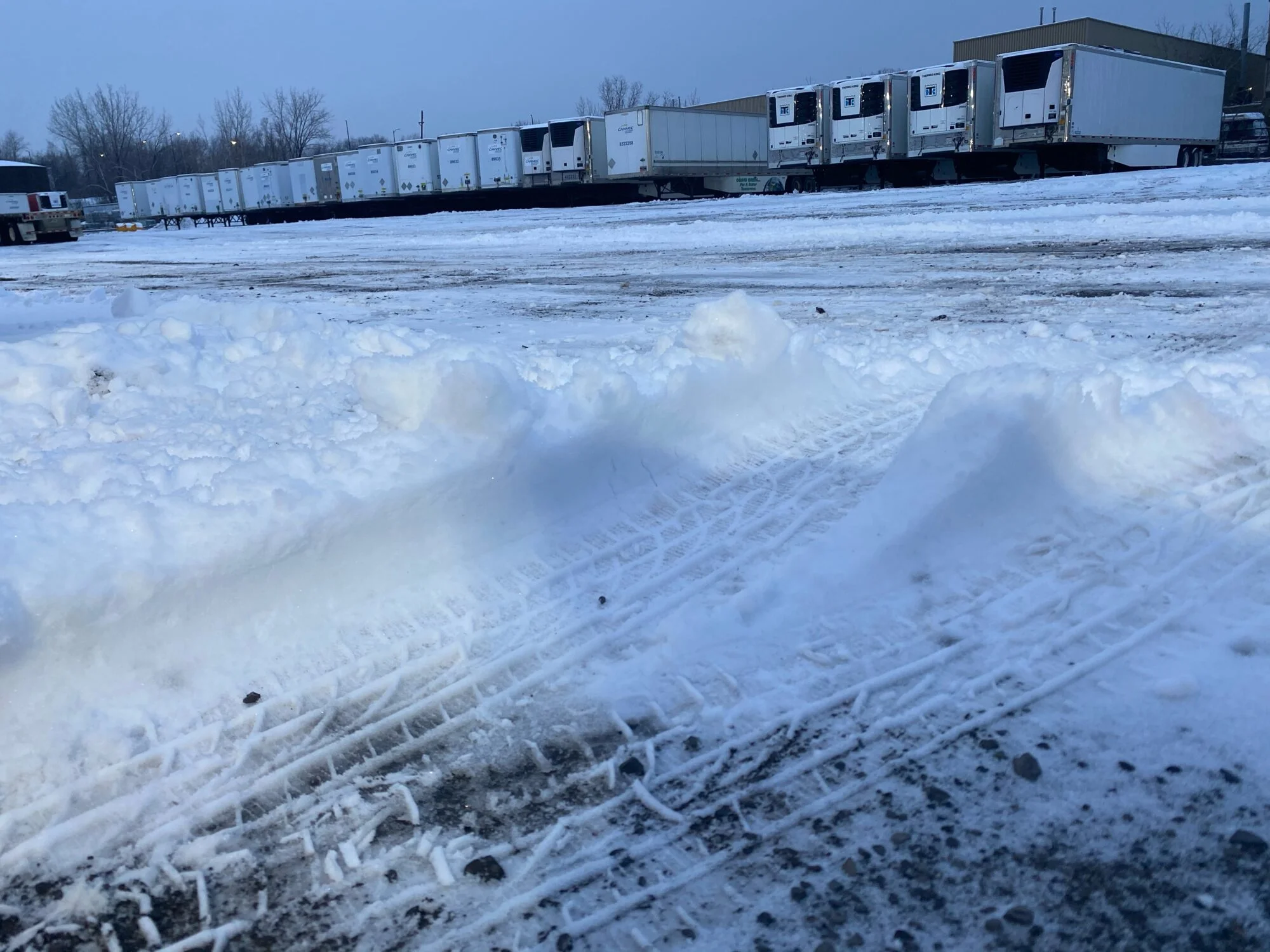 CANVEC rental trailers lined up in the yard